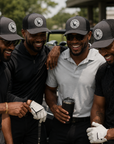 Dark gray trucker golf patch hat with black mesh sides and circular front logo patch