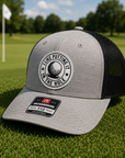Heather gray and black trucker golf hat with round 'I Like Putting' logo patch