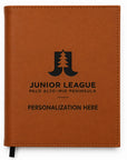 Brown leather notebook with Junior League Palo Alto-Mid Peninsula branding on a white background