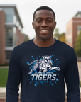 Black man wearing a Jackson State Blue Blitz Long Sleeve Navy Blue T-Shirt standing outdoors.
