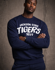 Man wearing a navy 'Jackson State Tigers' sweatshirt against a gray background