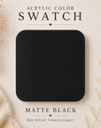 Matte black acrylic color swatch on a neutral background with text and decorative elements.