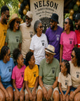 People wearing yellow Nelson family reunion T-shirts with tree logos at an outdoor event