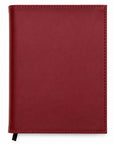Red notebook on a white background