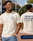 Man wearing a Jackson State University t-shirt with front and back text, standing outdoors.