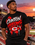 Young man wearing black Clinton Arrows graffiti T-shirt at a football stadium