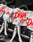 Close-up detail of Just A Diva from Delta Pi newspaper halftone and red print on black apparel