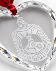 Close-up of precision laser engraving on crystal keepsake.