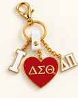 Delta Sigma Theta Delta Pi enamel bag charm with flat crimson ΔΣΘ heart, white I and ΔΠ charms, and gold-tone hardware