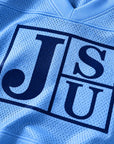 Close-up of Jackson State Block Letter JSU design on Carolina blue mesh jersey