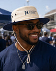 Jackson State supporter wearing Canvas Navy JSU Outback Hat at an outdoor football tailgate