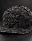 Jackson State Black Camo New Era 9FIFTY flat bill snapback with tone-on-tone black Tiger Head leatherette patch