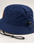 Rear three-quarter detail of Dress Blue Navy Port Authority outdoor bucket hat showing adjustable drawcord and crown toggle