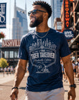 Navy performance t-shirt on a person, featuring front skyline and Tiger Takeover print