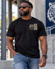 Black man wearing Jackson State Tigers Salute to Service black short sleeve T-shirt