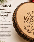 Close-up of natural wood slice ornament edge with laser-engraved Developing Women design