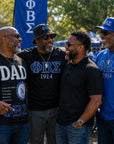 Phi Beta Sigma brothers gathered together wearing fraternity apparel at an outdoor event