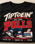Folded black Tiptoein’ to the Polls T-shirt