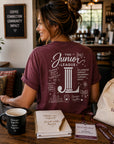 Woman wearing Women Who Build garment dyed graphic tee in a casual conference and coffee shop setting
