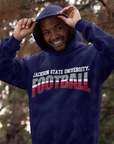 Navy pullover hoodie with Jackson State University Football tri-color logo, model adjusting hood
