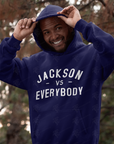 Navy pullover hoodie worn, with white 'JACKSON VS EVERYBODY' front print and drawstring hood
