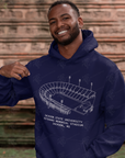 Navy unisex pullover hoodie worn by a person; stadium graphic and drawstring hood
