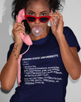 Person wearing navy short-sleeve crewneck T-shirt with Jackson State University 'thee' text.
