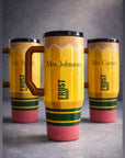 Set of personalized laser-engraved pencil tumblers, orange with names and black lids