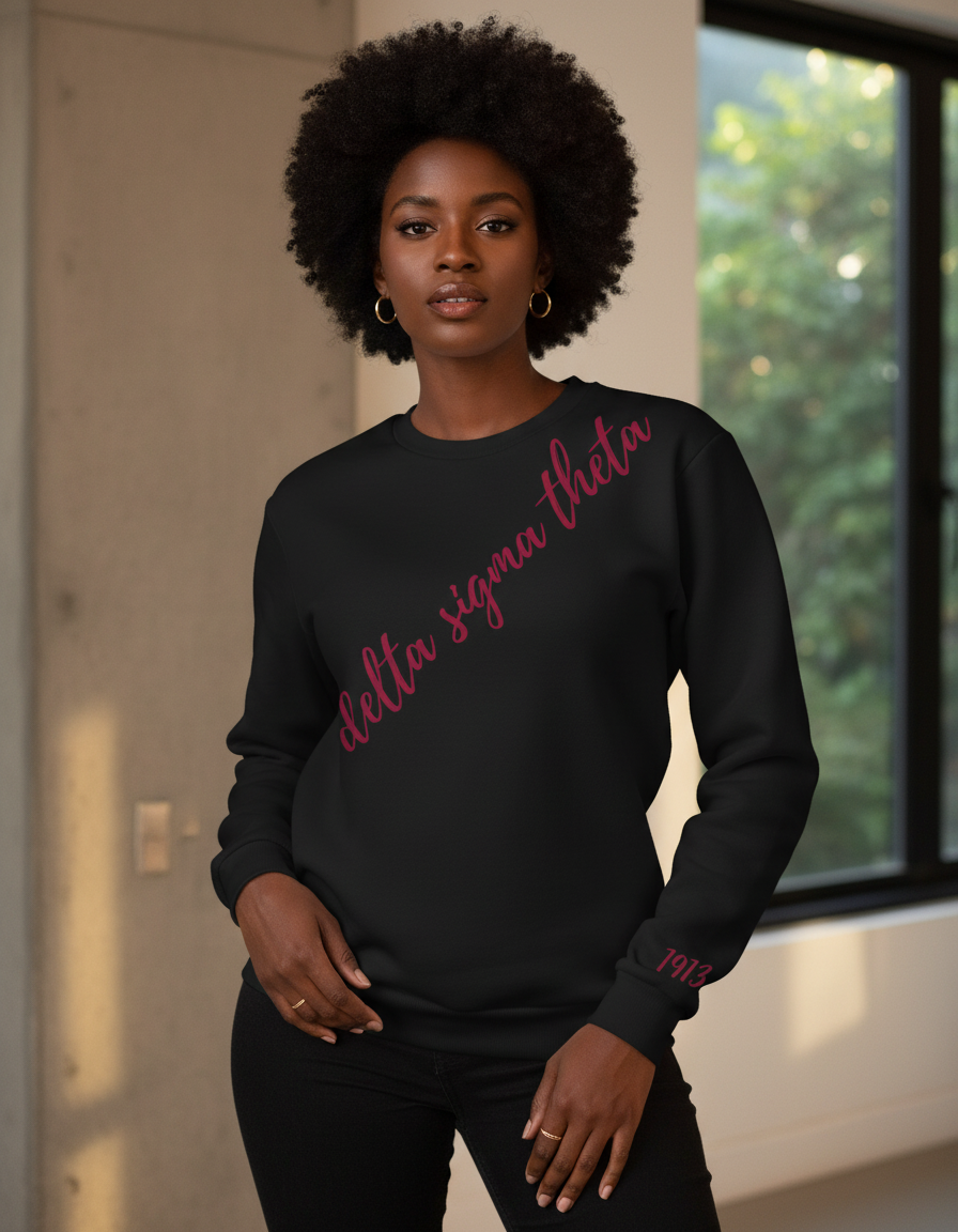 Person wearing a black sweatshirt with red text in an indoor setting