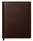 Brown leather notebook on a white background