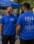 Two Phi Beta Sigma brothers wearing 1914 fraternity shirts after community service event showing front and back designs