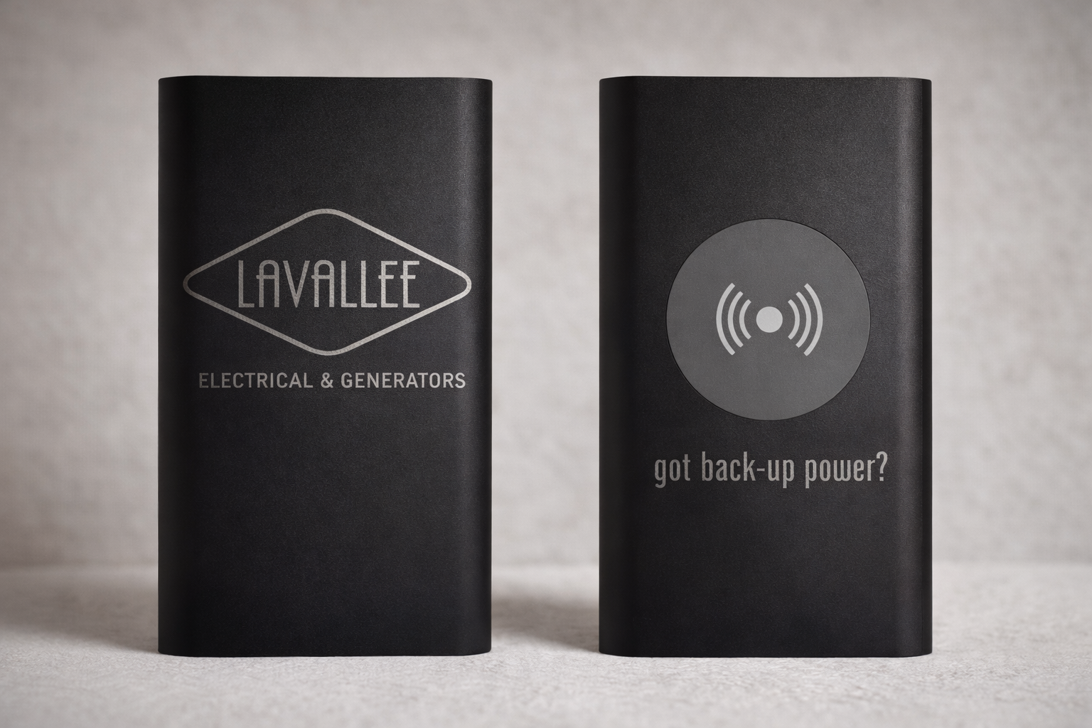 Two black power banks with 'Lavallee Electrical & Generators' and 'got back-up power?' text on a gray background.