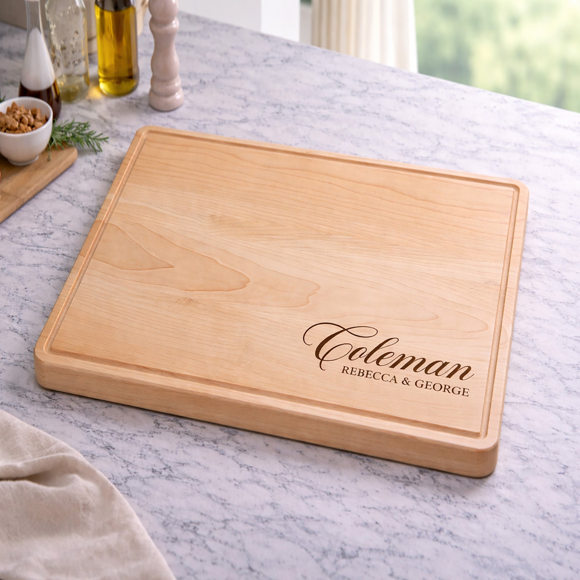 Wooden cutting board with engraved text on a marble countertop