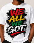 White Juneteenth graphic T-shirt with splatter “WE ALL WE GOT” front text