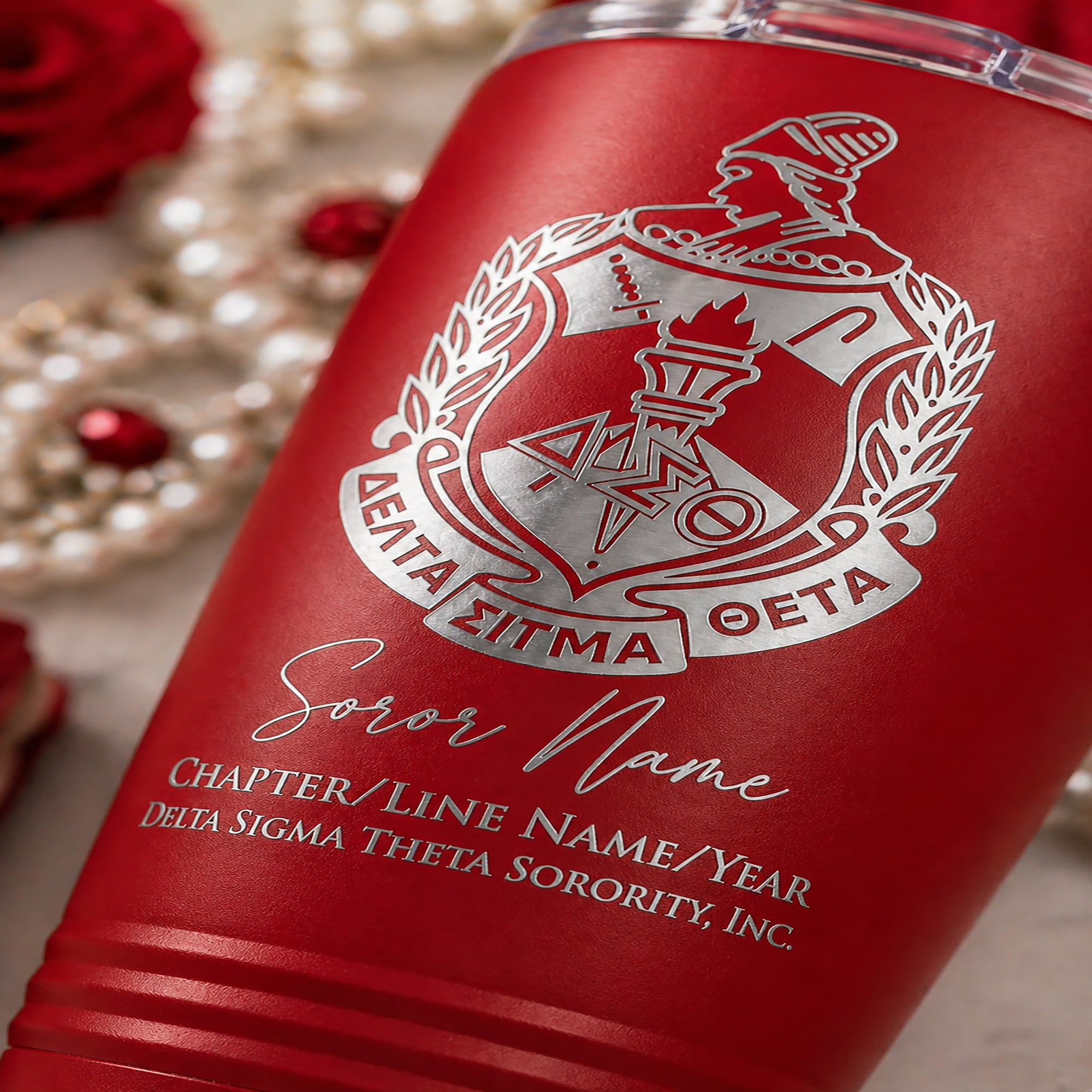 Red tumbler with Delta Sigma Theta sorority logo and text