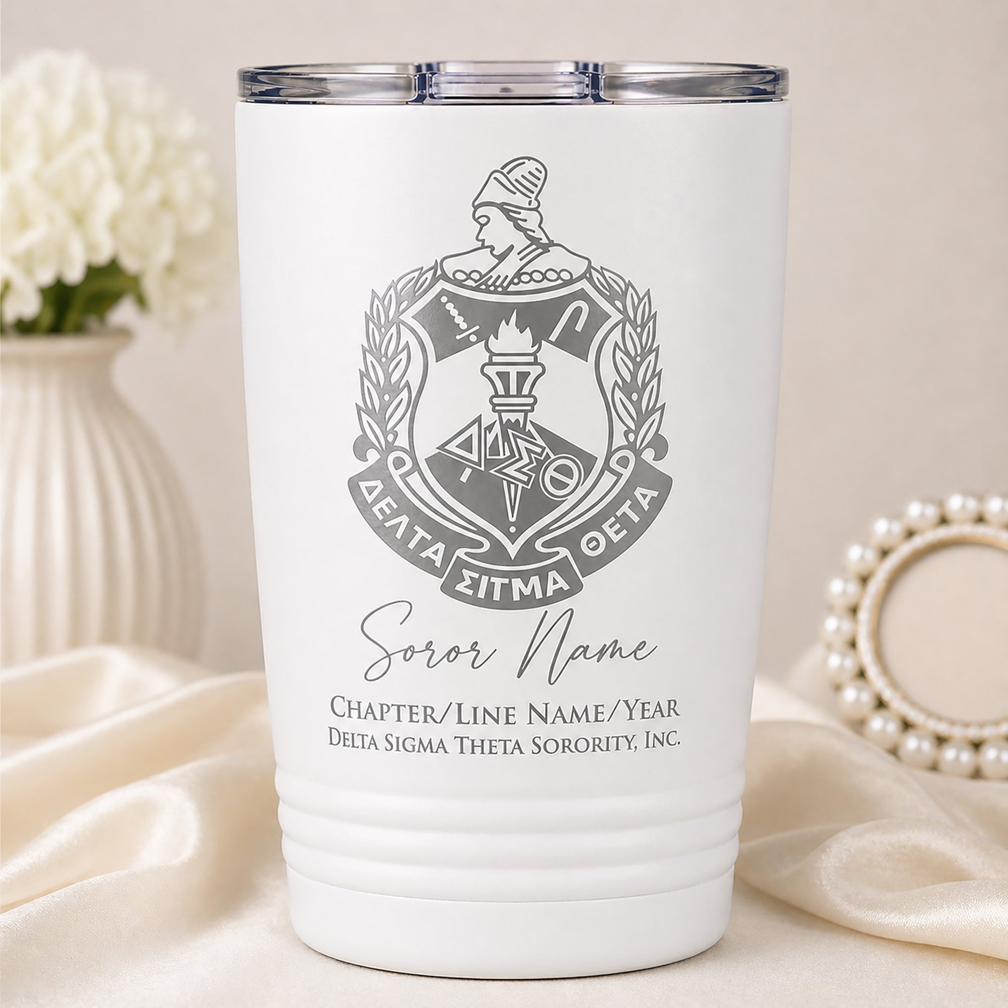 White tumbler with Delta Sigma Theta sorority emblem and personalized text on a neutral background.