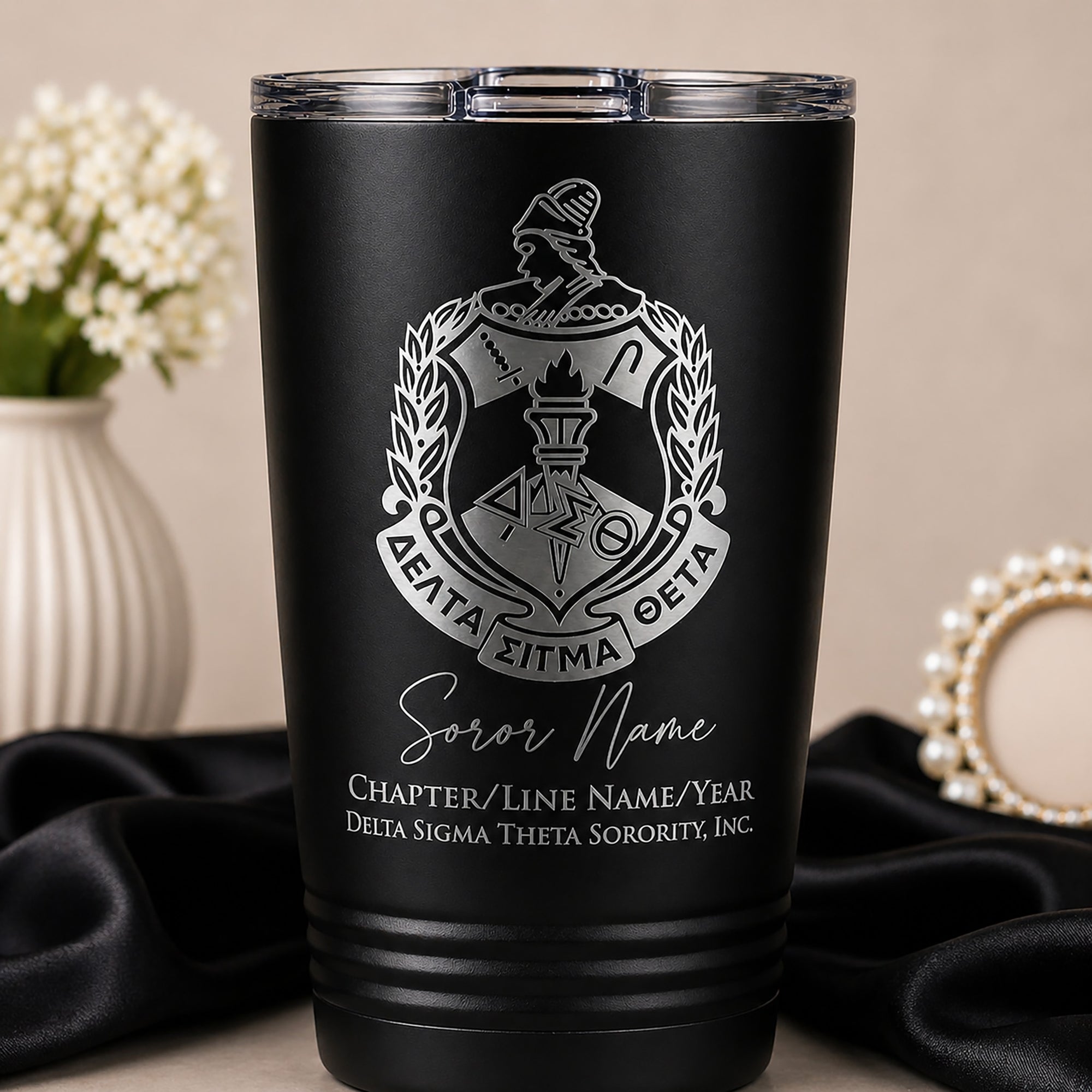 Black tumbler with Delta Sigma Theta Sorority, Inc. emblem and text on a neutral background