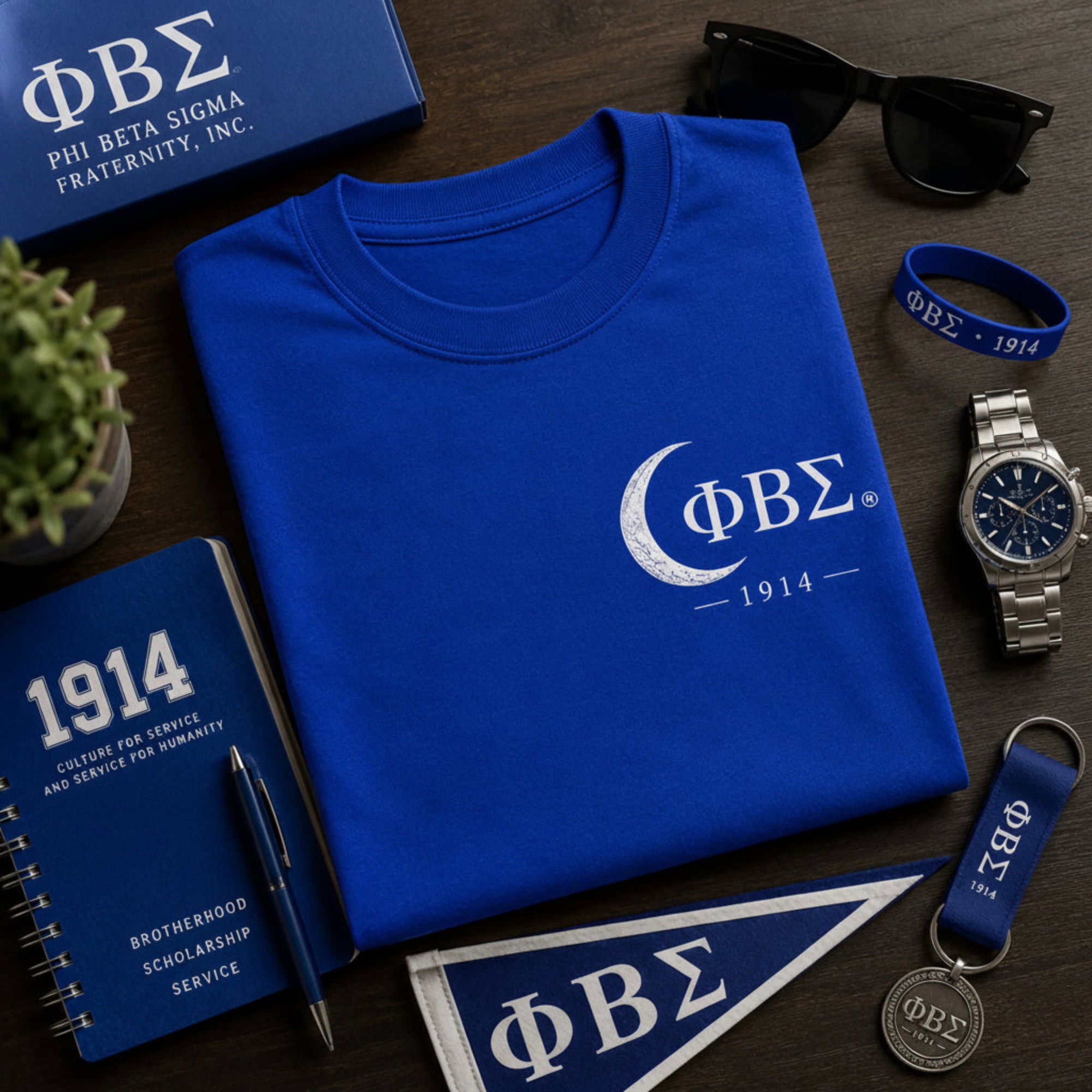 Phi Beta Sigma 1914 t-shirt displayed with fraternity accessories and professional lifestyle items