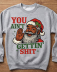 Heather gray crewneck sweatshirt with cartoon Santa graphic and bold slogan