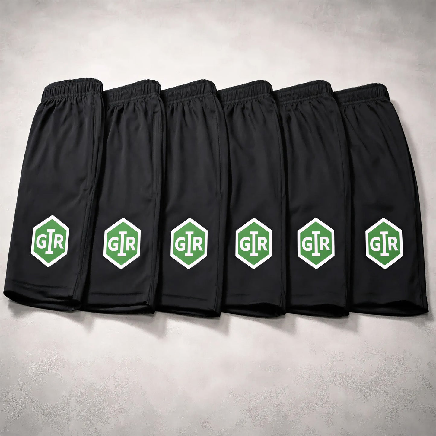 GIR Powersports black performance shorts with green logo