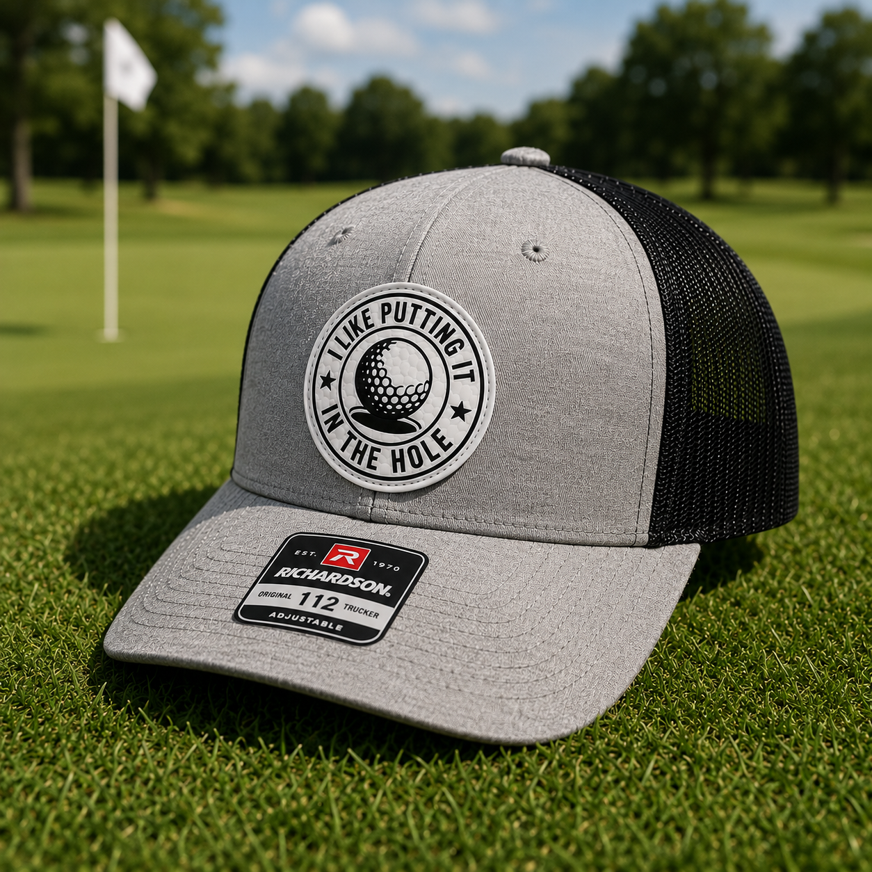 Heather gray and black trucker golf hat with round 'I Like Putting' logo patch