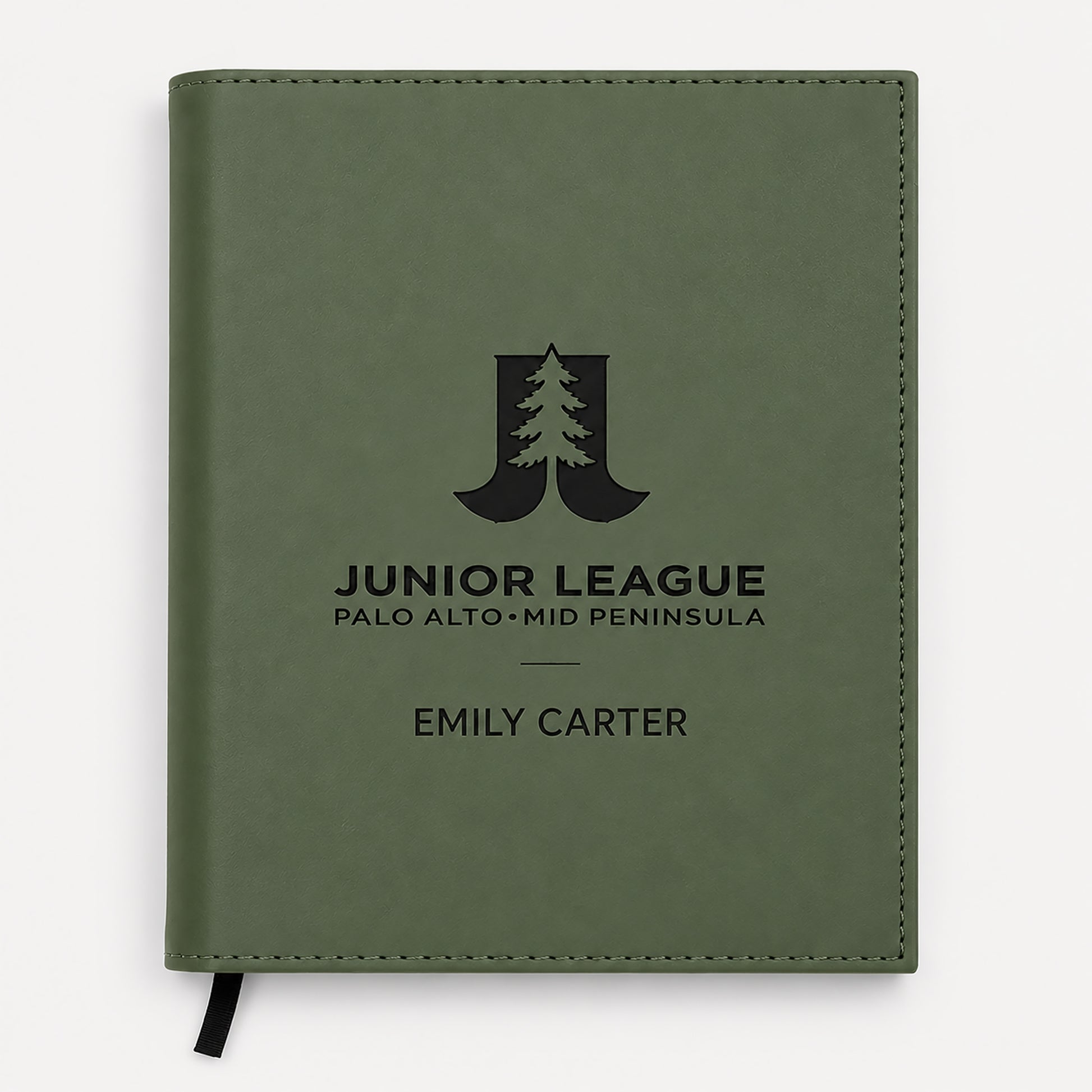 Green notebook with 'Junior League Palo Alto Mid Peninsula' logo and name on a white background