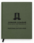 Green notebook withJunior League Palo Alto Mid Peninsula branding on a white background