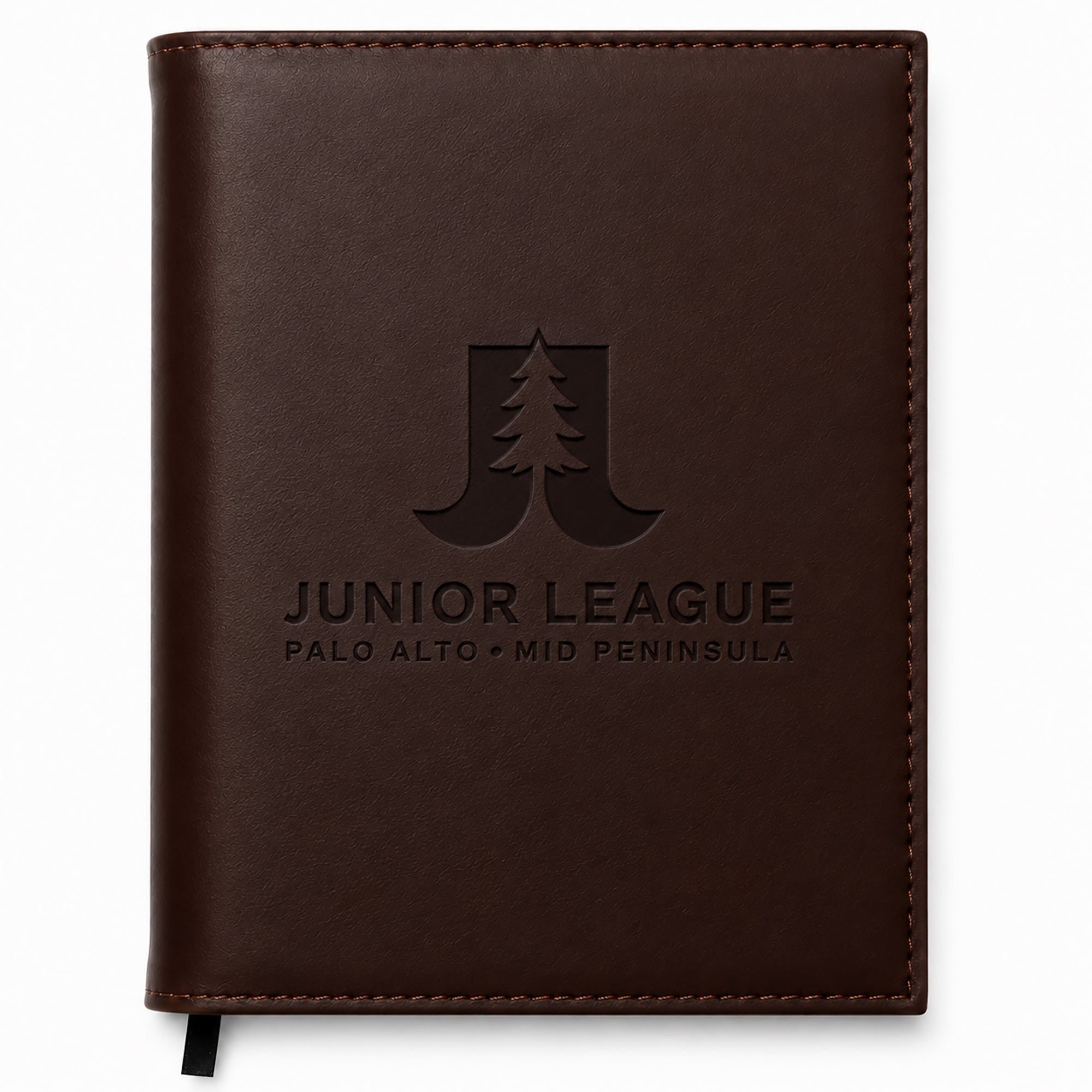 Brown leather notebook with 'Junior League Palo Alto Mid Peninsula' embossed on it