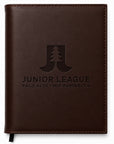Brown leather notebook with 'Junior League Palo Alto Mid Peninsula' embossed on it