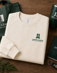 Natural raglan sweatshirt with chest logo, folded with accessories