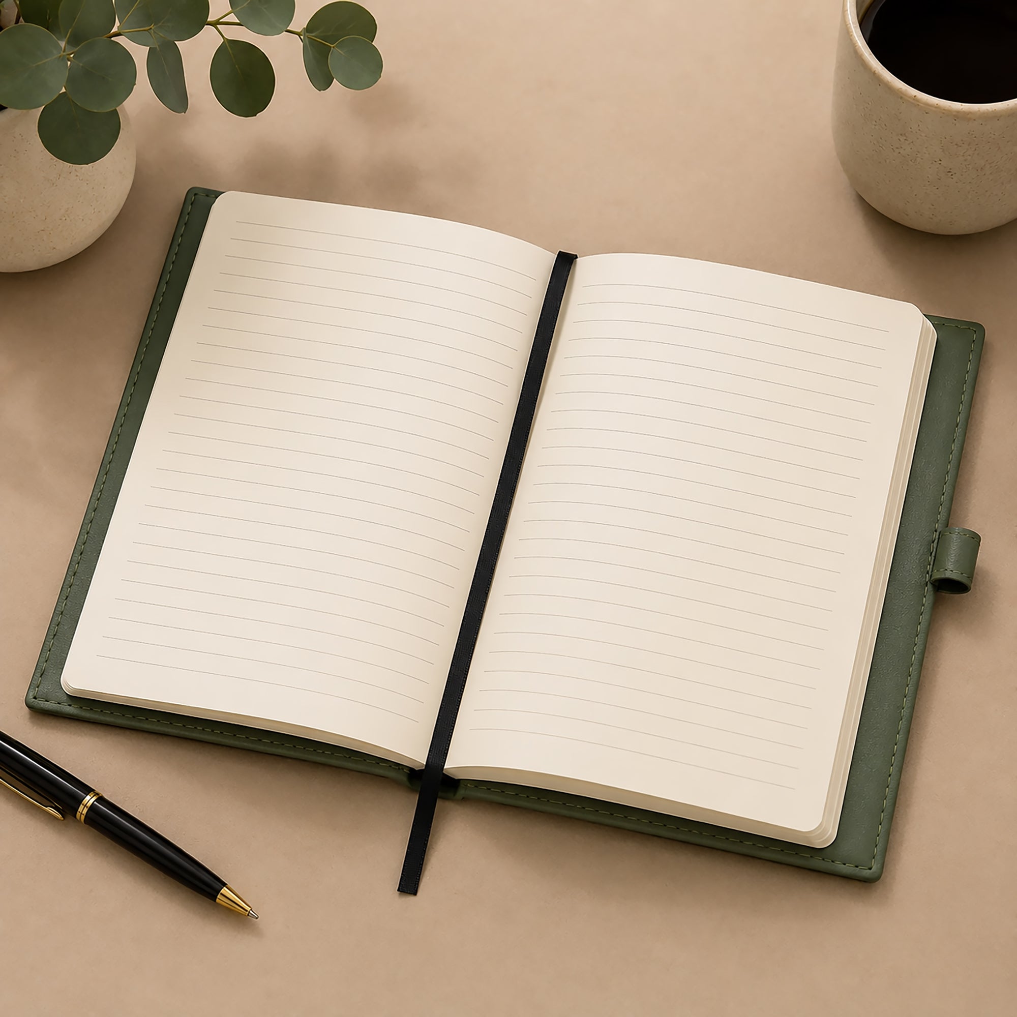 Open notebook with lined pages on a beige surface, accompanied by a pen and a cup.