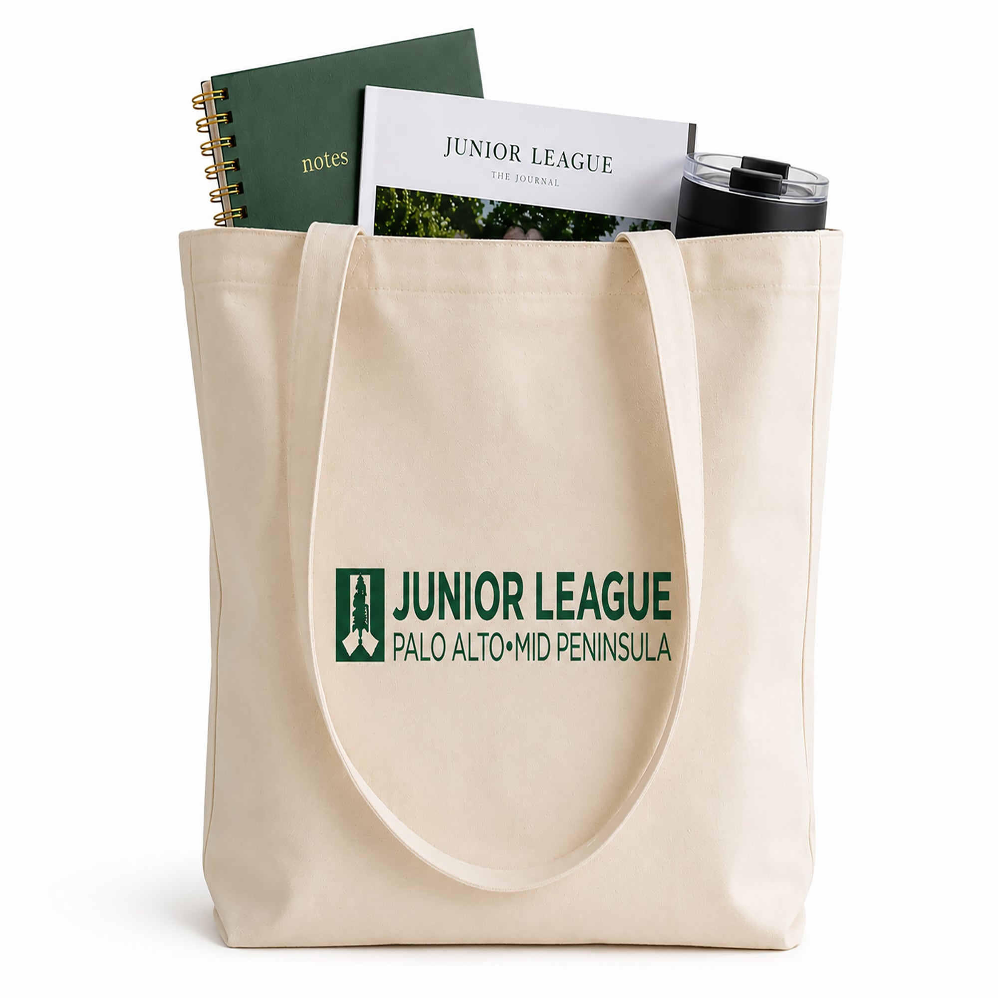 Tote bag with Junior League Palo Alto Mid Peninsula logo containing a notebook, book, and tumbler.