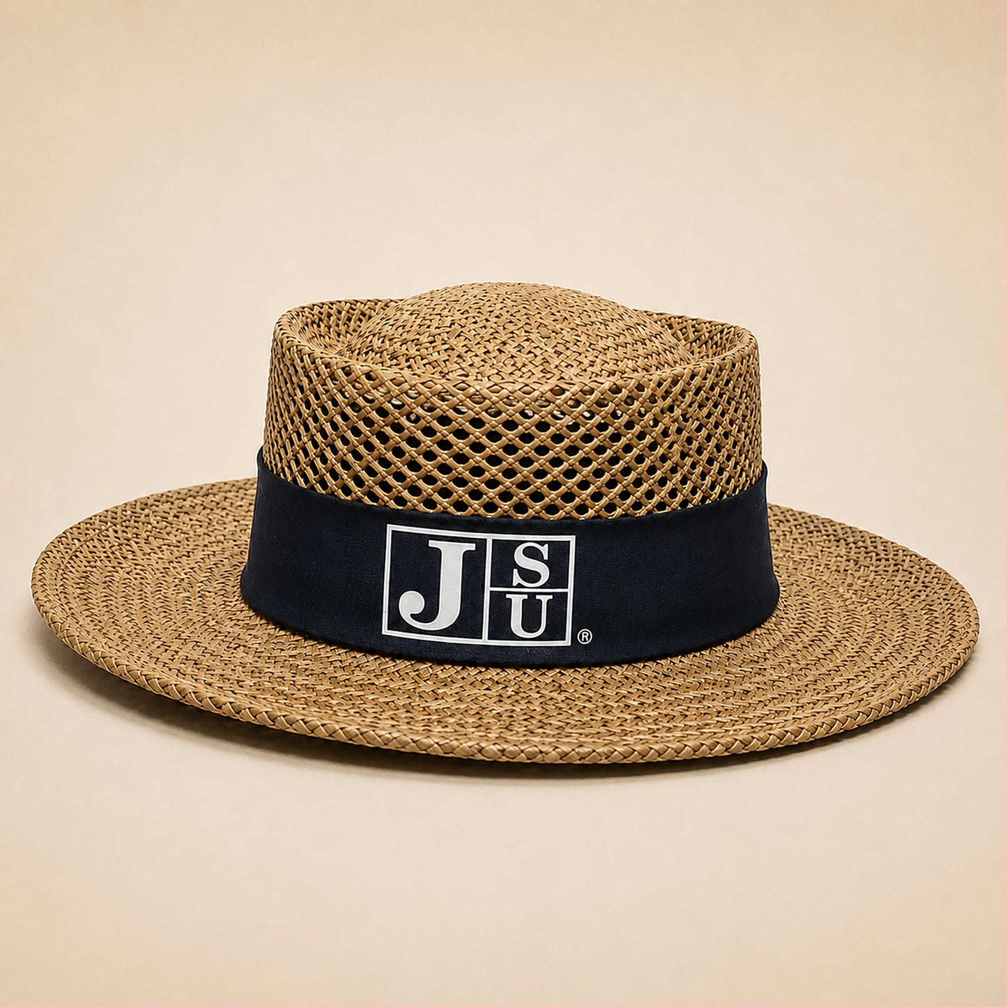 A straw fedora hat with a black band featuring the white 'JSU' logo, set against a solid beige background.