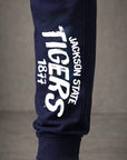 Close up detailed and texture shot featuring JSU Staple Arch design on navy blue jogger pant